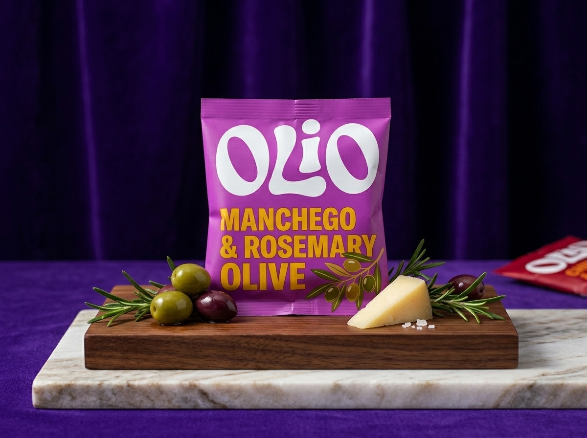 Manchego & Rosemary olive pouch styled with cheese and olives